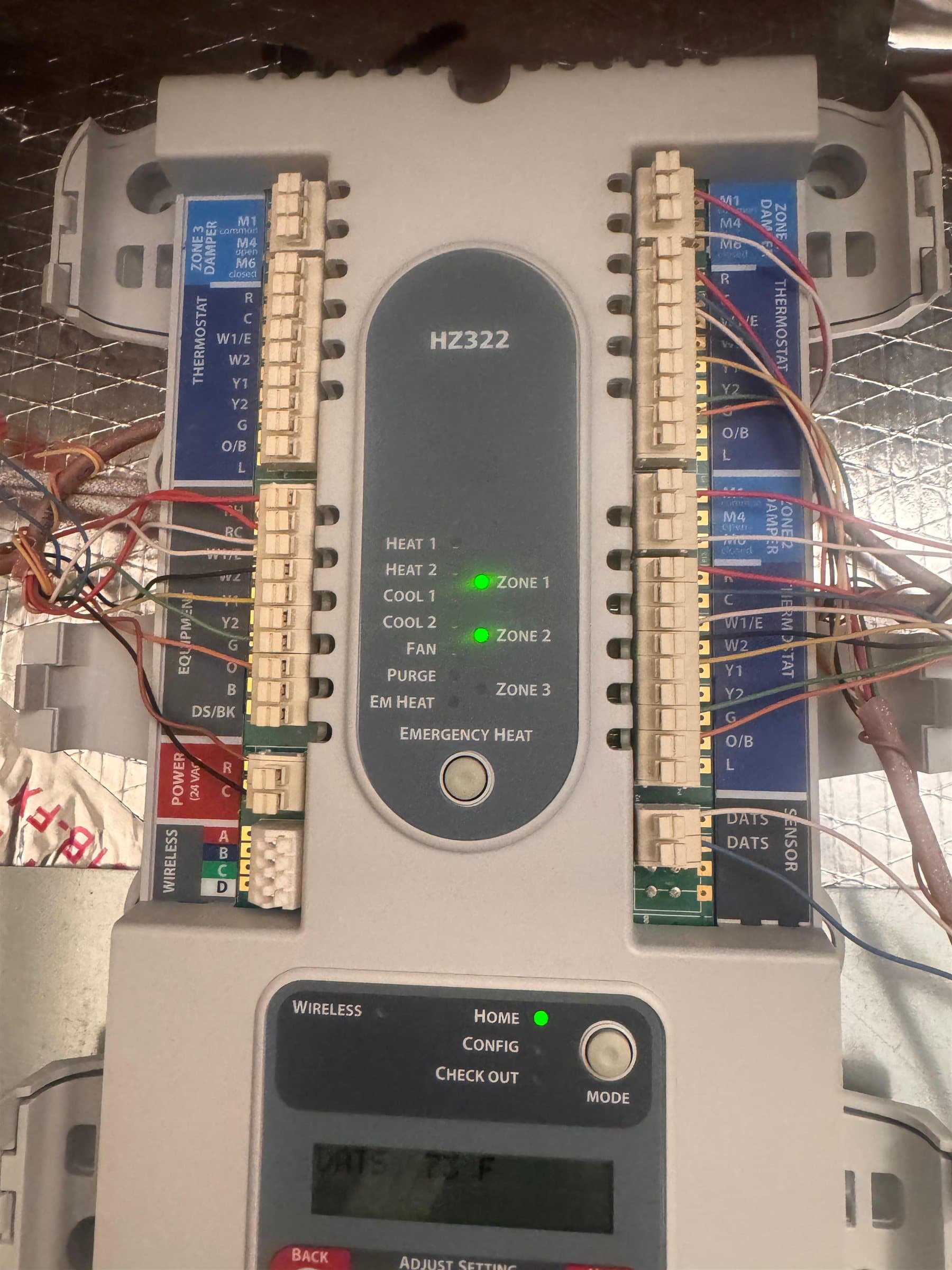Wired HVAC zoning control panel, model HZ322, with status lights on for zones 1 and 2.